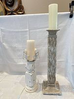 Front view of both candle holders with candles inserted