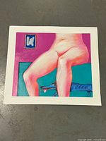 Full view of unframed mixed media artwork lying flat