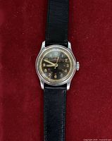 Front view of Mido Multifort watch on strap