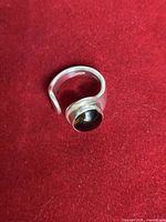 Ring front angle showing cabochon and open band
