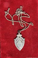 Pendant with chain overview on red background
