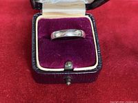 Sterling silver band in velvet ring box front view