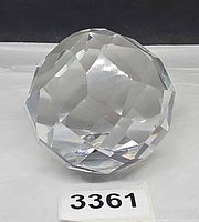 Front view showing faceted crystal paperweight