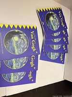 Stack of eight The Little Van Gogh paperback books in box