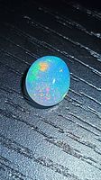 Oval Ethiopian opal cabochon showing play-of-color