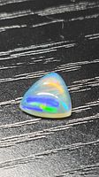 Top view of trillion opal showing play of colour