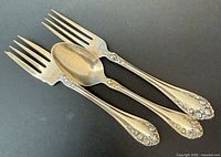 Top view of two forks and spoon displaying full design
