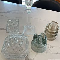 Group shot showing dish, candlestick holder, both insulators and candle holder