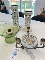Group shot showing all items: silver candelabra with glass bowl, green glass pedestal bowl with frog, pair of white wood pillars