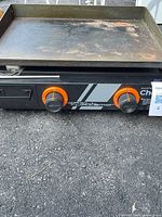 Front view showing Masterchef branding, dual orange knobs, overall unit