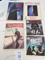 Four of the five Star Wars books displayed