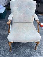 Full front view of upholstered accent chair