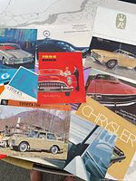 Group shot of all brochures showing covers and variety