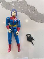 Full view of action figure and weapon accessory