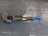 bundle showing both sledges, crowbars, rebar, angle iron