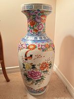 Front view of tall Famille Rose porcelain vase