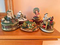 Group shot of five collectibles on shelf