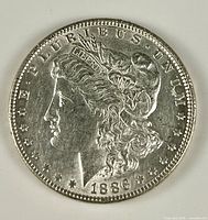 Obverse of 1886 Morgan silver dollar showing Liberty