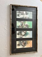 Front view of framed artwork showing four landscape prints in silver faux bamboo frame