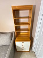 Front view of full bookcase showing shelves and drawers