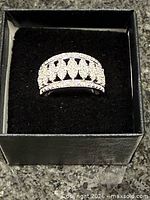 Front view of diamond ring in box