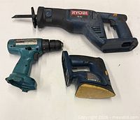 All three cordless tools laid out on white background