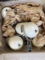 Box containing five white pot light fixtures