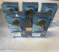 Five shrink-wrapped Amsau Pet Restricted Area Spray boxes displayed upright