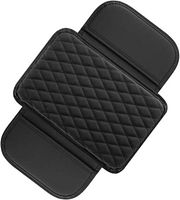 Top view of black diamond-stitched armrest cover with side flaps