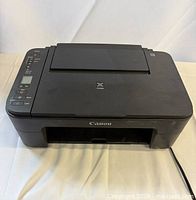 Top and front view of Canon PIXMA printer