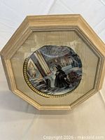 Front view showing framed plate and overall condition