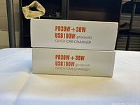 Front of two product boxes showing model information