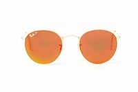 Front view of sunglasses showing gold frame and orange lenses with Ray-Ban logo