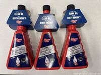 Front view of three sealed Kleen-Flo Engine Flush/Rinse bottles
