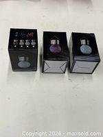 Three small boxed solar hanging globe lights