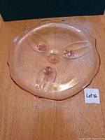 Top view of pink etched glass cake plate