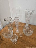 Group shot showing all eight clear glass and crystal pieces