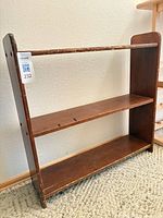 Front view of brown three-tier bookshelf