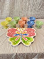 Full lot showing butterfly platter and eight pastel dessert cups