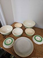 Full set of bowls, lids and platter displayed on table