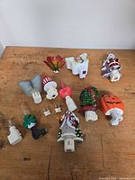 Overview of all 14 night lights and accessories on wooden table