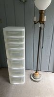 Full view of lamp and six-drawer storage tower side by side
