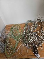 Three garlands coiled on tabletop