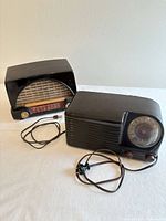 Front view of both radios with power cords visible