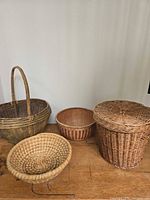 All four wicker and rattan baskets grouped on table