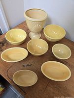 All eight yellow Oven Serve pieces displayed on table