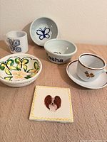 Group shot showing all eight ceramic and porcelain pieces