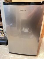 Front view of Whirlpool stainless-front compact refrigerator