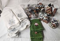 Entire lot showing towels, pinecones, village buildings and cottage
