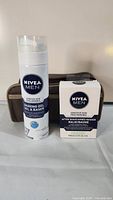 Shaving gel, after shave balm and toiletry bag grouped